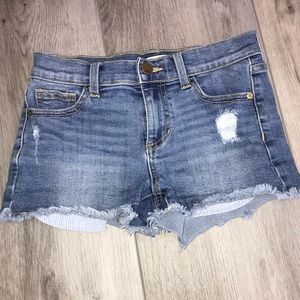 Cute girls shorty shorts with striped pockets out